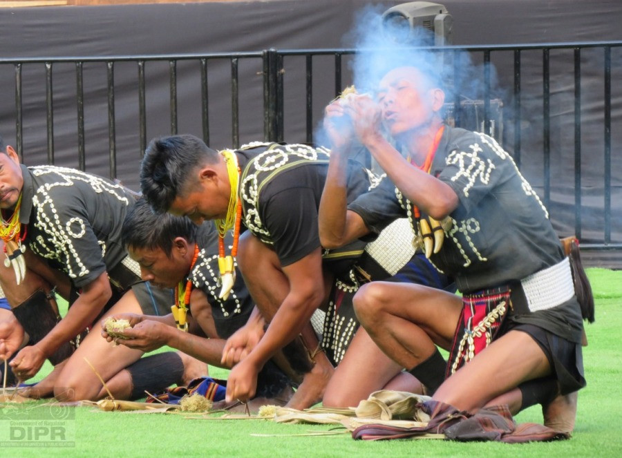 Chang cultural troupe demonstrates traditional way of making fire at the Hornbill Festival 2021 on December 3 at Kisama. (DIPR Photo)